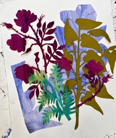 an art project with paper cut flowers and leaves