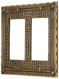 two light switch plates with decorative designs on the front and back sides, one is gold