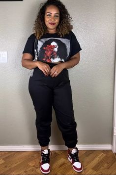 Graphic tee, black pants, red and white sneakers for a cool, urban look. Plus Size Fashion