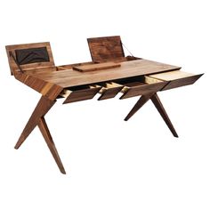 a wooden desk with drawers and a laptop on it