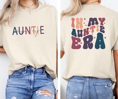 In My Auntie Era Shirt, Auntie Shirt, Aunt Gift, Aunt Era Shirt, Auntie Crewneck, To Be, Auntie Gift From Niece, Eras Shirt, Cool Aunt Shirt We are proud to use premium shirts from Bella Canvas and Gildan Soft Style for our prints. **Bella Canvas - Unisex sizing - Lightweight at 4.2 oz. - Available in various compositions including 100% Combed Cotton, Ring-Spun Cotton, and Polyester blends. **Gildan Soft Style - Unisex sizing - Available in different fabric compositions, including Ring Cotton, Polyester blends, and 100% Ring Cotton. --- **HOW TO ORDER YOUR T-SHIRT** 1. Browse our captivating product photos. 2. Select your preferred style and color from the dropdown menus. 3. Personalize it with your chosen text color. 4. Indicate the desired quantity. 5. Click "ADD TO CART" and proceed wit Auntie T Shirts, In My Auntie Era Shirt, In My Auntie Era, Aunt Shirts For Adults, Aunt And Niece Shirts, Auntie And Niece, Auntie Sweatshirt, Auntie Era, Cool Aunt