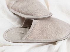 Slip into these cozy slippers and make the home being time even more pleasant. Made from natural fabrics, among which includes natural linen blend and leather which ensures quality and comfort. Made in a beige color. The leather sole ensures that the slippers are non-slip while the interior linen fabric makes them breathable.  These are the perfect indoor slippers, with the cozy upper part, lightweight insole with cushioning, designed to feel comfortable. A great choice for home use, while trave Cream Slip-on Slippers For Indoor Use, Beige Cushioned Slippers For Indoor Use, Cream Slip-on Indoor Slippers, Comfy Beige Slip-on Slippers, Beige Comfy Slip-on Slippers, Comfortable Natural Slippers With Rubber Sole, Indoor Beige Slippers With Textured Footbed, Comfortable Beige Indoor Slippers, Beige Indoor Slippers