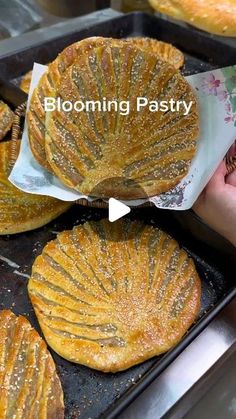 several pastries are being prepared on a baking sheet in a bakery setting with the words blooming pastry above them