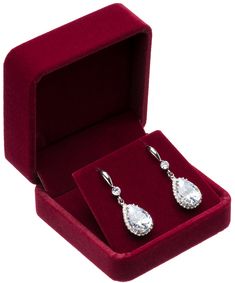 a pair of earrings in a velvet box