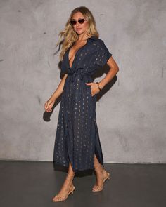 Designed with the modern woman in mind, the Marylin Lurex Waist Tie Maxi Dress is here to help you embrace the new season. Made from lightweight crepe jersey fabric and subtle lurex threading that adds just the right touch of shimmer to your wardrobe. The detachable waist tie accentuates your silhouette while allowing for versatility; cinch it for a figure-flattering shape or let it flow for a more relaxed fit. Lightweight crepe jersey fabric with lurex threading design Front button closure Detachable waist tie accent Side slant pockets Lined 98% Viscose 5% Metallic Let It Flow, Tie Maxi Dress, Sleeveless Cardigan, Swimwear Bottoms, Maxi Dress Navy, Threading, Long Sweaters, Fall Dresses, Hat Hairstyles