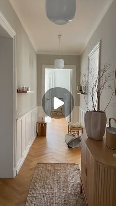 the hallway is clean and ready to be used as a living room or dining area