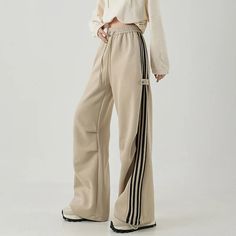 Trendy Wide Leg Sports Pants, Sporty Spring Pants, Beige Wide Leg Sweatpants For Streetwear, Trendy Wide Leg Sports Bottoms, Beige Wide-leg Sweatpants For Streetwear, Spring Sportswear Trousers, Spring Sports Straight Pants, Full-length Beige Athleisure Pants, Beige Full-length Athleisure Pants