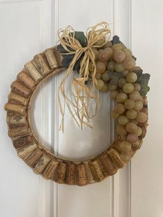 a grape wreath hanging on the front door