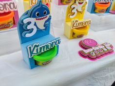 there are many different kinds of candy on the table with each one's name