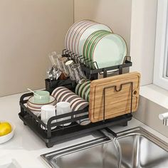 the dish rack is holding dishes in it