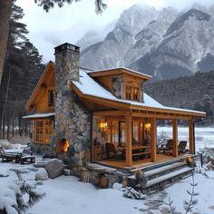 a log cabin sits in the snow with mountains in the background