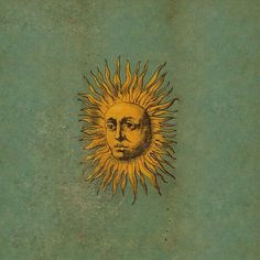 an old book with a drawing of a sun face on it's front cover