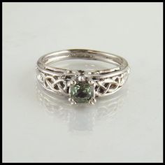 Celtic Cathedral Ring in White Gold with Green Sapphire Wedding Rings Sage Green, Irish Engagement Rings Celtic Wedding Bands, Sage Wedding Ring, Sage Green Wedding Rings, Sage Green Rings, Green Wedding Ring Silver, Nontraditional Wedding Rings Silver, Non Diamond Engagement Rings Silver, Nontraditional Engagement Rings Silver