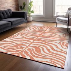 an orange and white rug in a living room