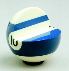 a blue and white striped ball with the letter u on it