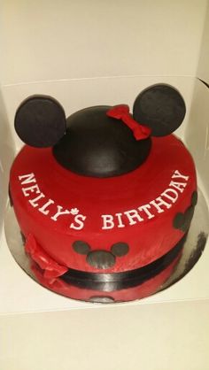 a red and black mickey mouse cake in a box