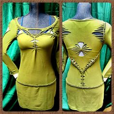 a green dress with cut outs and beads on the back