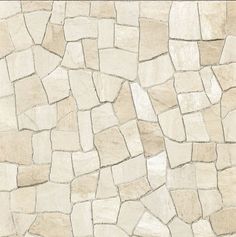 a stone wall that is white and beige