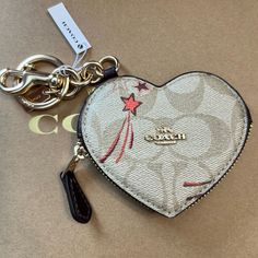 Nwt Coach Heart Bag Charm Coin Purse Signature Canvas With Hearts And Shooting Stars Coach Heart Bag, Birthday Stuff, Heart Bag, Car Personalization, Cell Phone Holster, Phone Holster, Signature Canvas, Coach Accessories, Key Card Holder