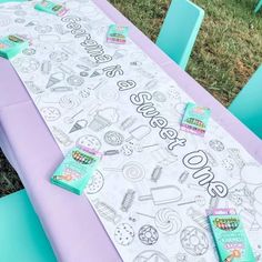 the table is covered with markers and stickers for an ice cream themed birthday party