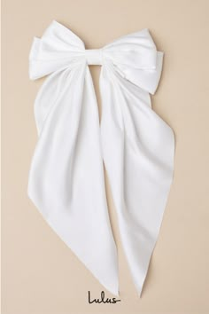 Adding a piece like the Lulus Adorable Inclusion White Satin Bow Hair Clip to any 'fit will instantly enhance the romantic vibes! This ultra-femme accessory features a sleek satin bow that boasts a layered design and long elegant tails, all atop a silver alligator clip-style closure. From the rehearsal dinner to the big day, this darling bow will add a charming touch to any look. Bow measures 7" wide. Ribbon measures 12. 5" long. 90% Polyester, 10% Iron. Imported. Lulus | Adorable Inclusion White Satin Bow Hair Clip. White Bow For Hair, Bridal Hair With Bow, Bridal Hair Bow, Hair Tie Bow, Glinda Costume, Clara Nutcracker, Hoco Dance, White Hair Bow, Satin Hair Bow