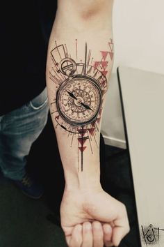 a person with a tattoo on their arm holding a stopwatch in the palm of their hand