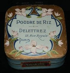 an old tin box with flowers on the side and writing that reads poudre de riz delettrez