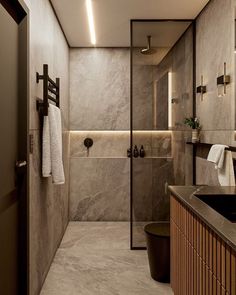 a bathroom with marble walls and flooring