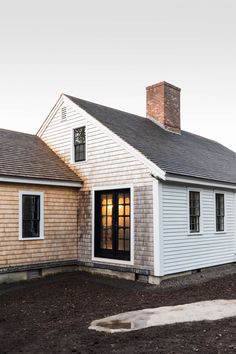 a white house with black doors and windows