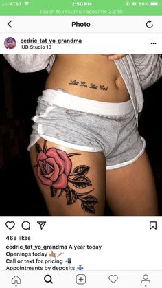 a woman's stomach with a rose tattoo on it