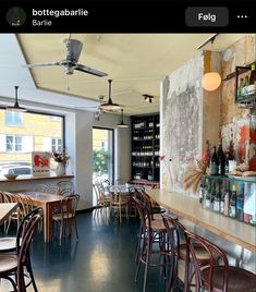 an empty restaurant with lots of tables and chairs