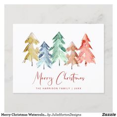 merry christmas card with watercolor trees in red, green and blue on the front