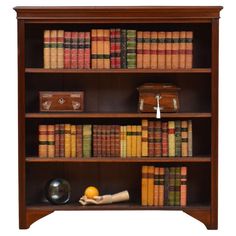 an old bookcase with books and other items on the shelves, isolated against a white background