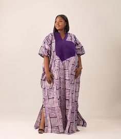 Step into the regal charm of the Remi Maxi Dress, a tribute to one of our visionary co-founders. This Adire and Asooke Bubu in enchanting purple captures the essence of sophistication and cultural richness. Crafted with precision, the dress features a flowing silhouette that effortlessly combines traditional Adire with the elegance of Asooke. The Remi Maxi Dress is not just a garment; it's a statement of grace and style. Please note: This gown fits all sizes, and it is available in regular and t Adire Bubu Styles, Bubu Gown With Vintage Material, Purple Bubu Gown Styles, Bubu With Ankara, Butterfly Bubu Gown Styles, Different Types Of Bubu Gown, Tall Maxi Dress, Boubou Styles For Women, Bubu Gown Styles