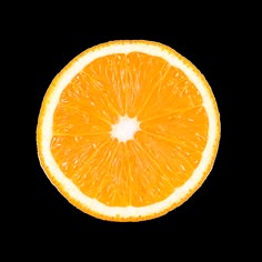 an orange cut in half on a white background