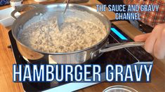 the sauce and gravy is being cooked on the stove top by someone using a spatula