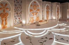 an elaborately decorated room is lit up with lights and decorative wallpapers on the walls