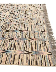 a multicolored rug with fringes on it