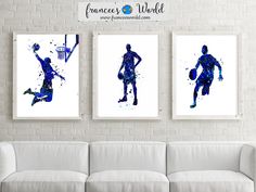 three watercolor paintings of basketball players in blue and white, hanging on a brick wall