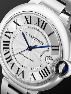 Cartier's 'Ballon Bleu' watch is named for the floating blue cabochon that's nestled in the crown. Crafted in Switzerland from stainless steel, this 40mm reference has a silvered flinqué and lacquered sunray-effect dial with a date window, black Roman numerals and indices, sword-shaped hands and an interchangeable bracelet made up of curved links so it sits comfortably. We offer a two-year warranty for all working parts and manufacturing faults for luxury watches. For more information, contact … Interchangeable Bracelet, Latest Watches, Cartier Ballon Bleu, Cartier Watch, Steel Watch, Stainless Steel Watch, Roman Numerals, Silver Watch, Stainless Steel Bracelet