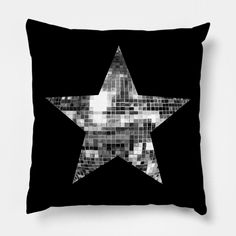 a black and white photo of a star pillow