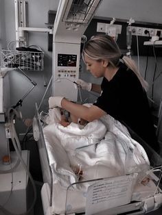 a woman in a hospital bed with an iv machine