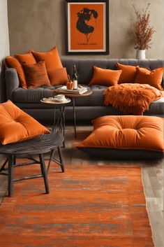 a living room filled with furniture and an orange rug