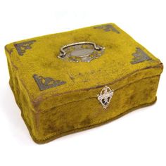 an old yellow box with silver handles on a white background