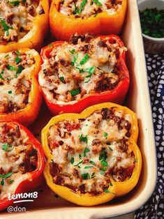 stuffed bell peppers with meat and cheese in a casserole dish, ready to be eaten