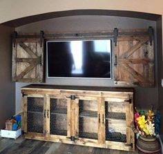 an entertainment center made out of old barn doors