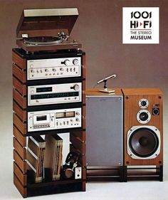 an old record player and stereo system are stacked on top of each other