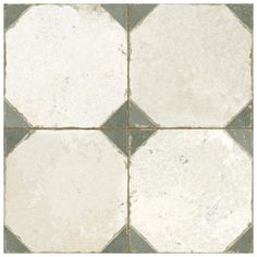 a white and grey tile floor with squares on it's sides, in different sizes