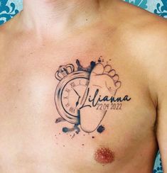 a man's chest with an alarm clock tattoo on it and the name atlanta written in black ink