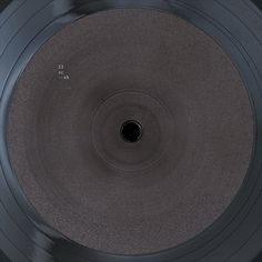 an old record player's turntable is shown from above